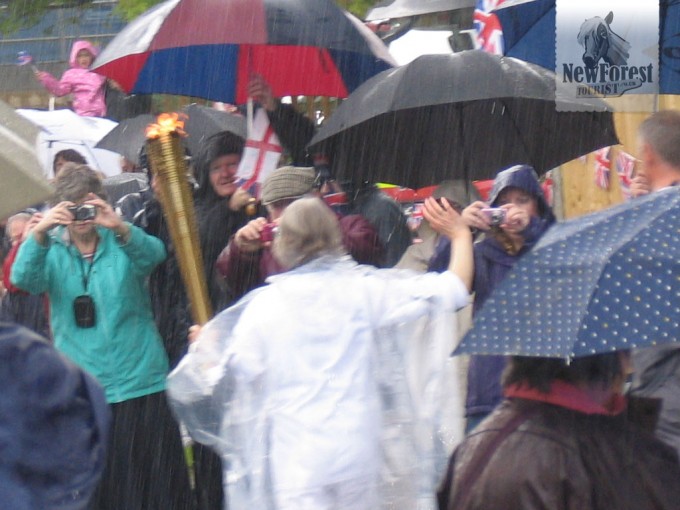 Olympic Torch Relay Runner in Rainy Lymington